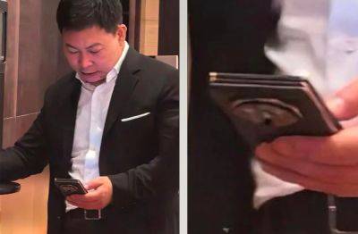 Huawei’s Tri-Fold Smartphone With Large Rear Camera Bump And Three ‘Sandwiched’ Super-Thin Panels Spotted In The Hands Of Company Executive